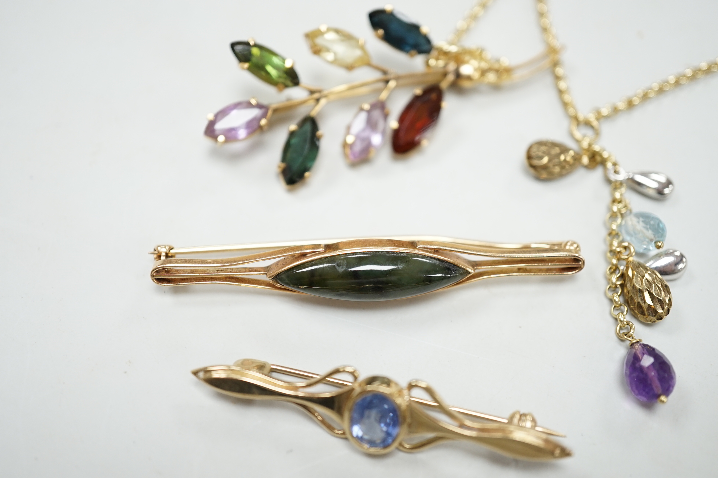 Three modern yellow metal and gen set brooches including 9ct gold and a modern 9ct gold and gem set necklace, gross weight 16.8 grams.
